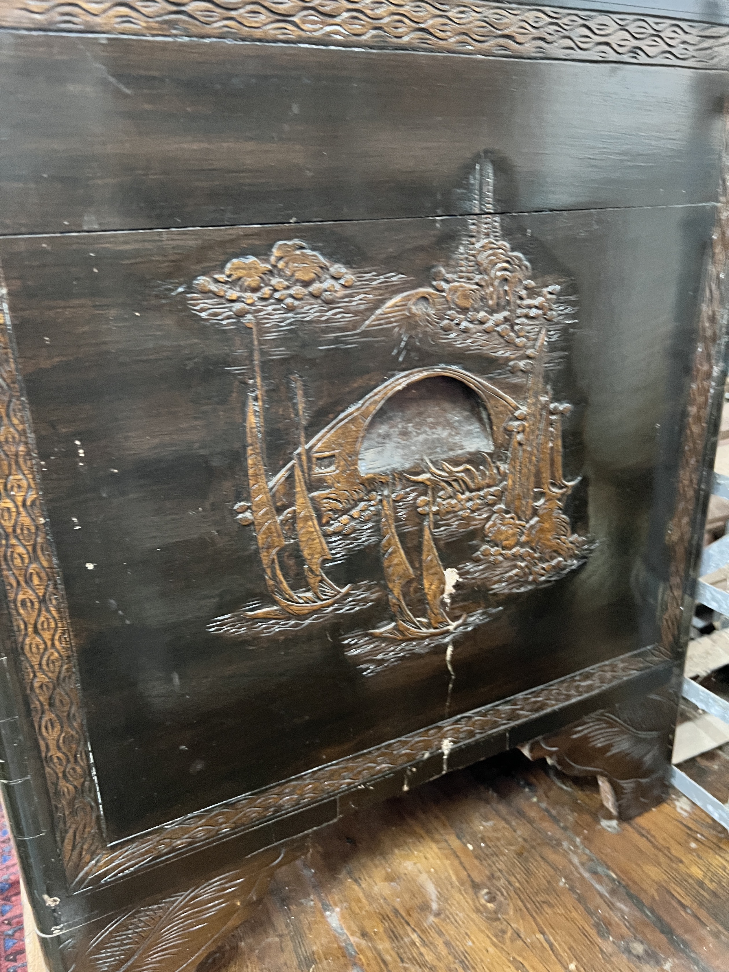 A Chinese carved camphorwood trunk, width 104cm, depth 54cm, height 66cm